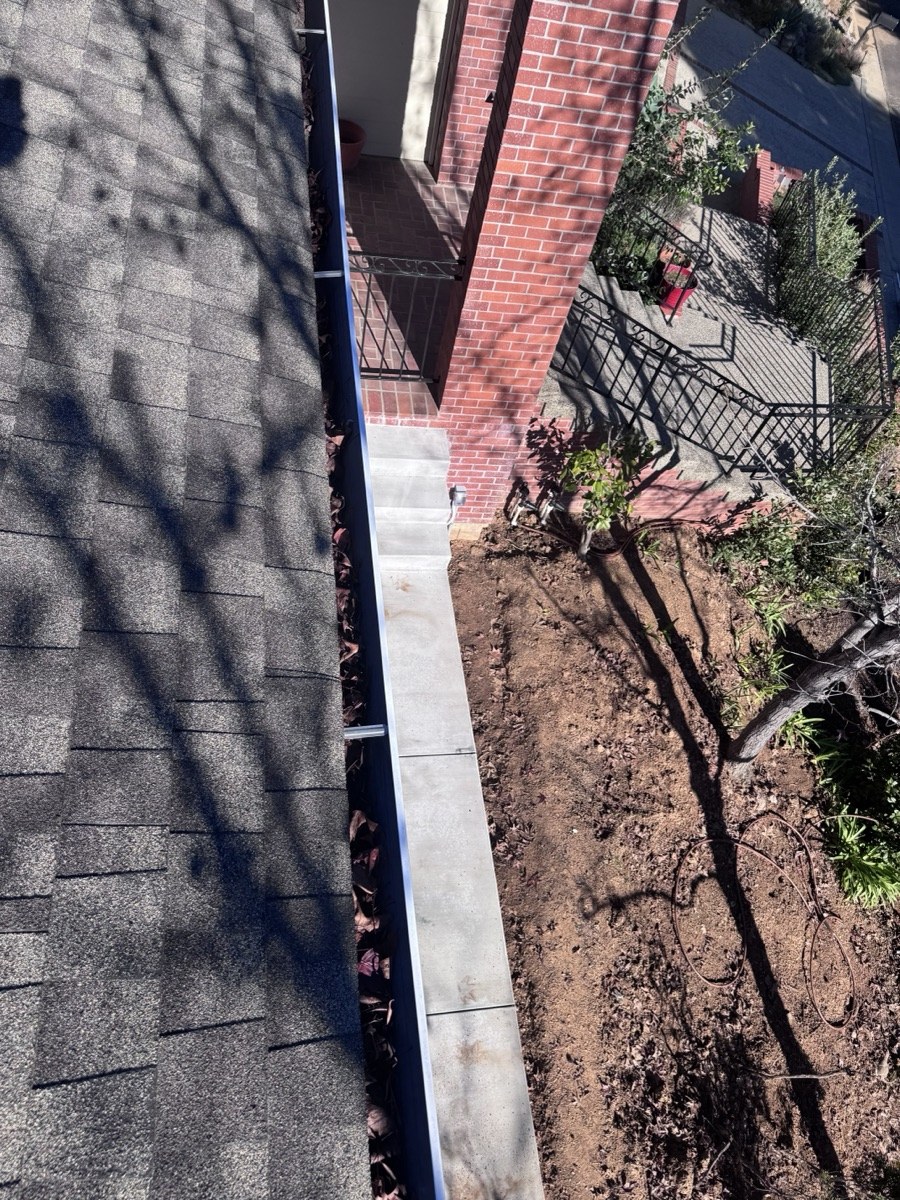 Gutters packed with leaves before cleaning — Los Gatos CA job